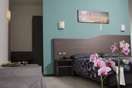 Rainbow Hotel - triple aquamarine room